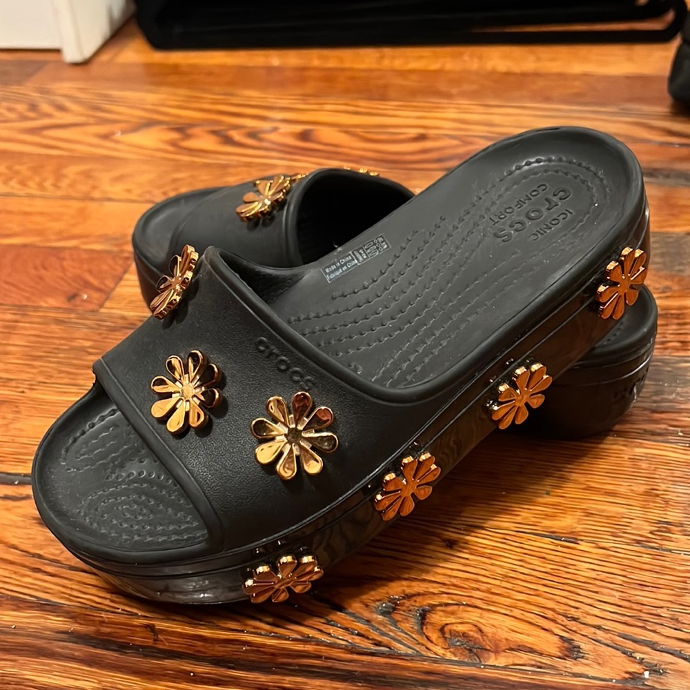 Black platform Crocs with Gold flower detailing